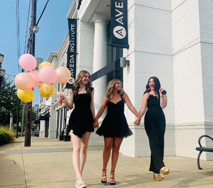 Group of Aveda Arts Students and Graduate in front of Aveda Building In Atlanta