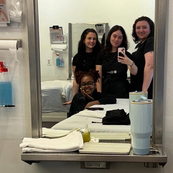 Aveda Arts Beauty School Students - Student Life - Posing in Mirror