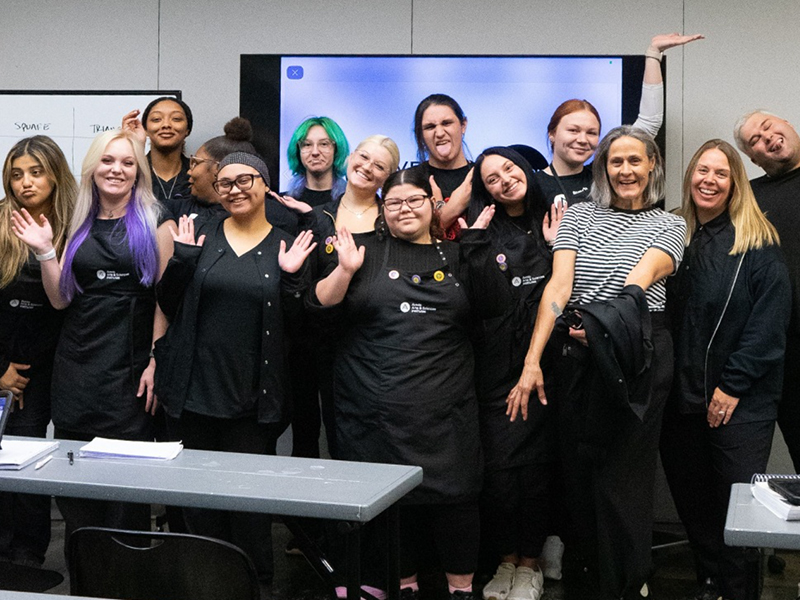 Group of beauty school cosmetology and esthiology students and educators at Aveda Arts & Sciences Institutes.