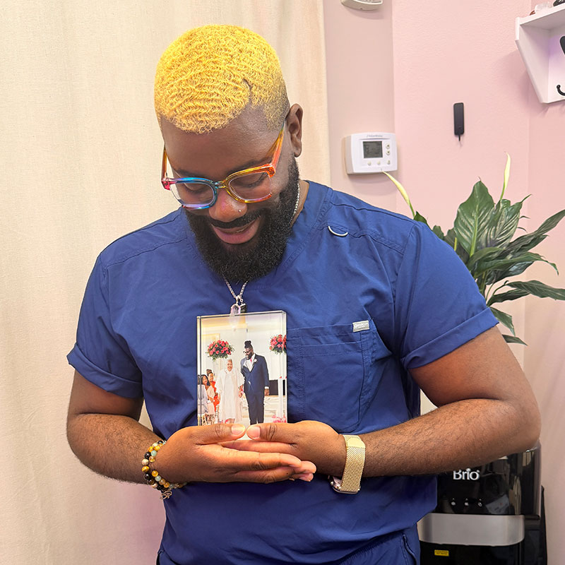 Alumni Victor Anthony inside his Arlington hair restoration clinic