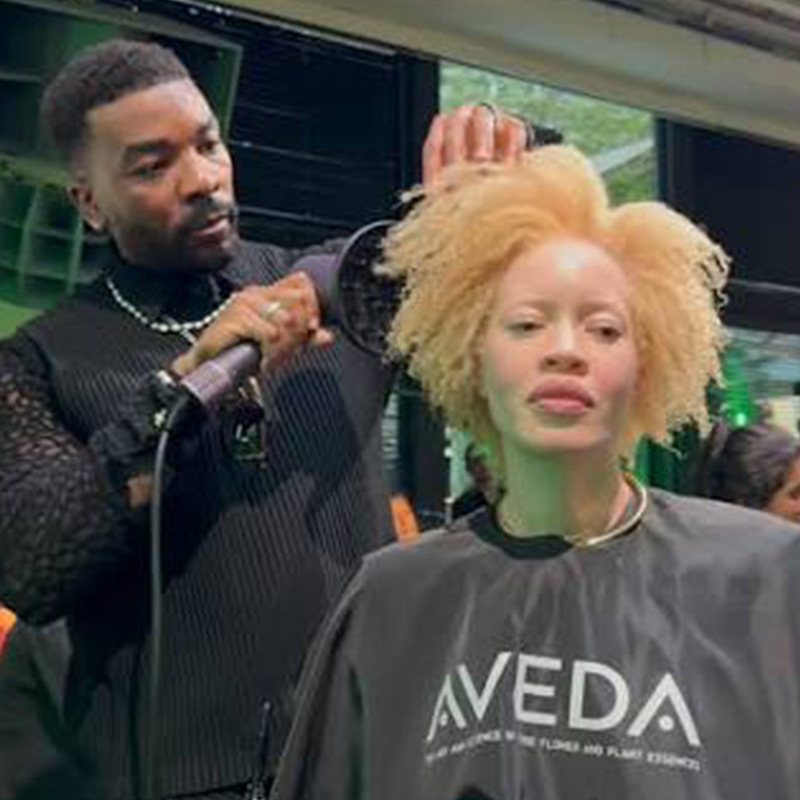Kenneth Dawson at Aveda One For All Event Performing Hair on Stage